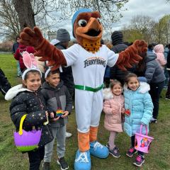 Little kids posing with the SI FerryHawk's mascot.
