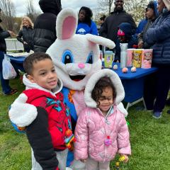 Little kids posing with the bunny.