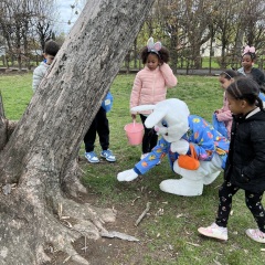 Bunny helping kids find beeping eggs.