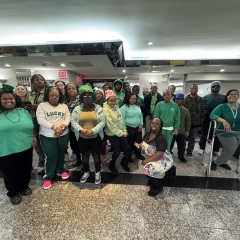 In celebration of St. Patrick's Day, participants pose with bright smiles, festive hats, and fun accessories to mark the occasion.