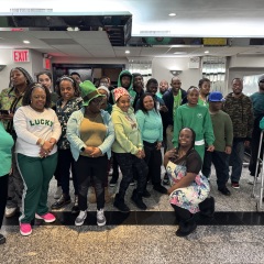 In celebration of St. Patrick's Day, participants pose with bright smiles, festive hats, and fun accessories to mark the occasion.
