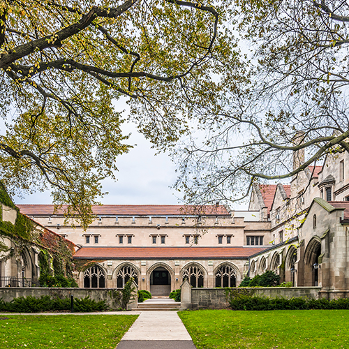 picture of a building with trees surrounding it