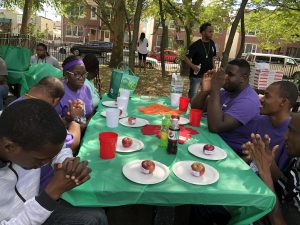 Participants sitting around a table in Dyker Park